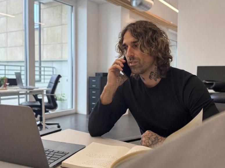 Gio Georgiou on a sales call in a bright Swiss office