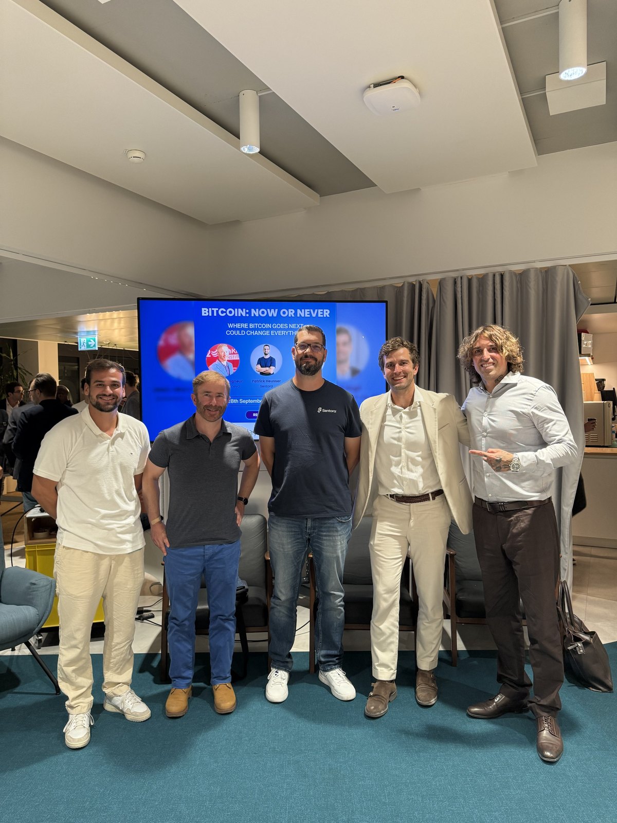 Gio Georgiou with the panel speakers after a CryptoMondays Zurich event